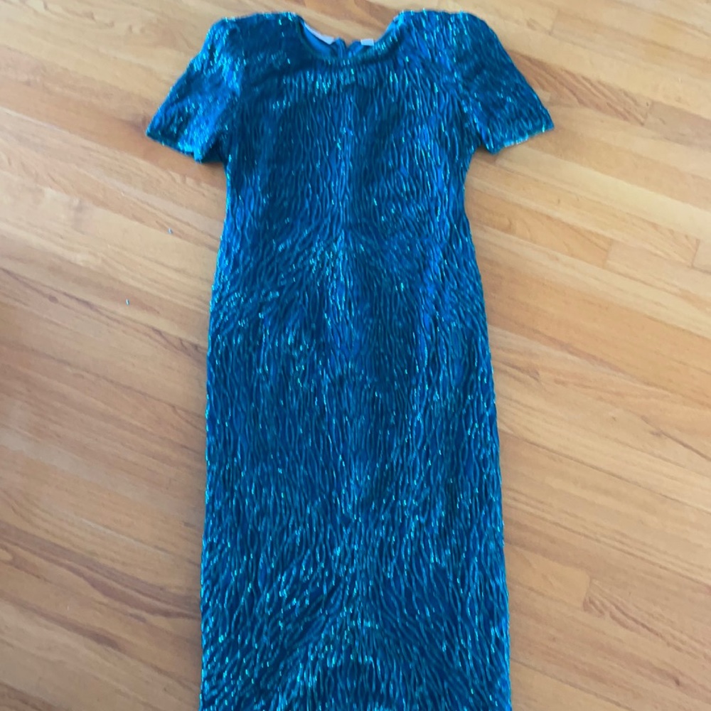 Green sequined maxi gown. Short sleeve. Size XL Similar fit to a 12/14 today.